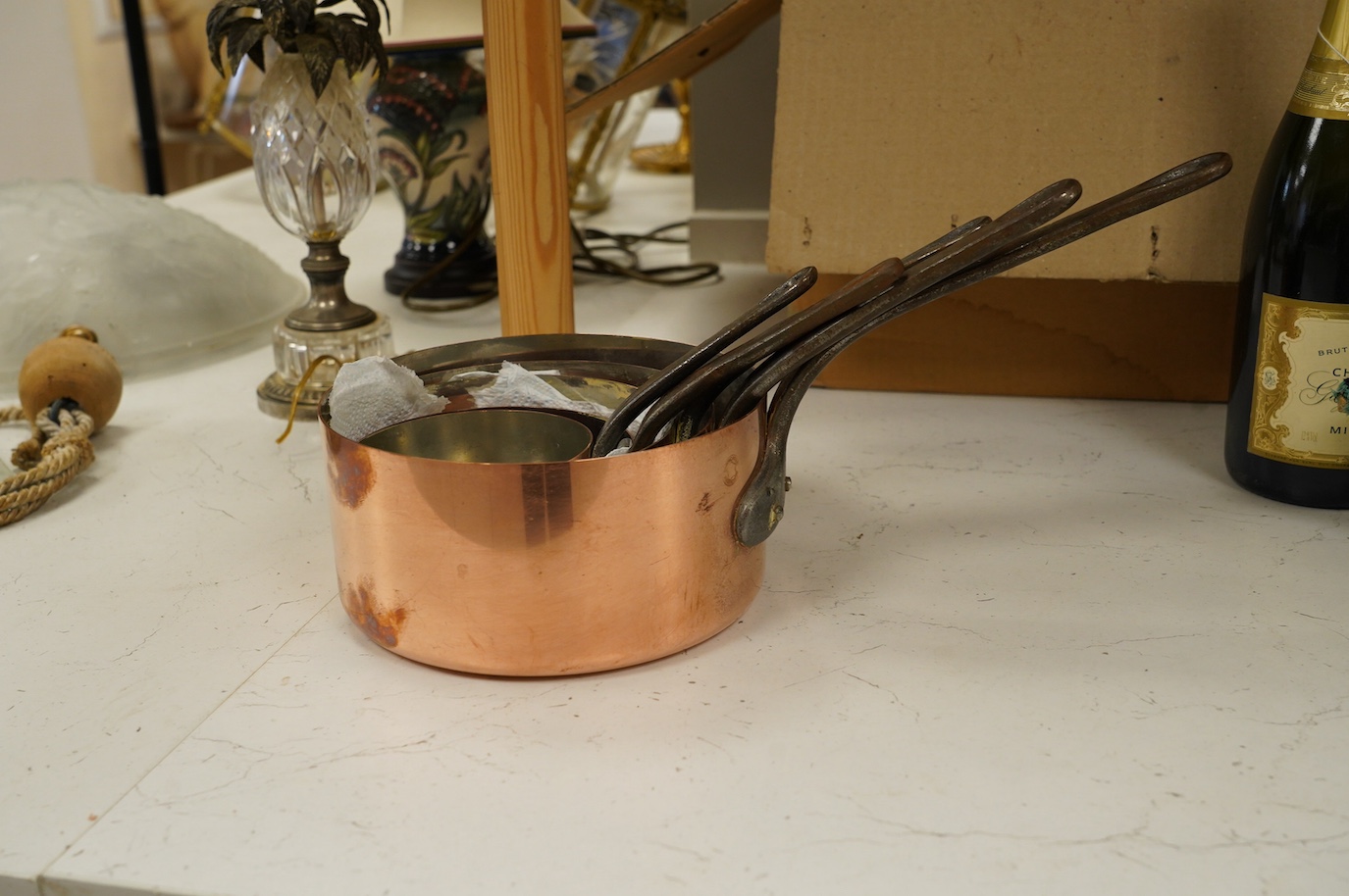 A set of five graduated copper pans, largest diameter 18cm. Condition - fair